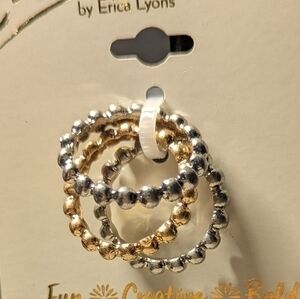 Erica brand. Set of three rings in silver and gold hues.NWT.